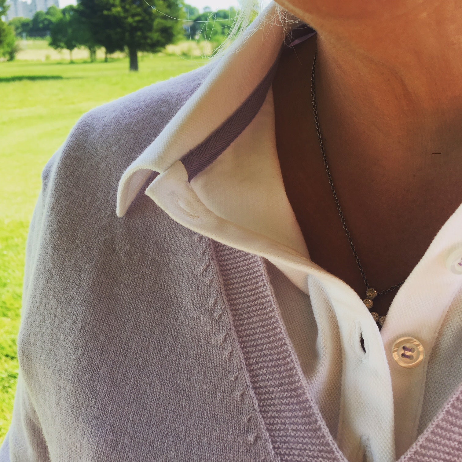 Ladies polo shirt in white & lilac